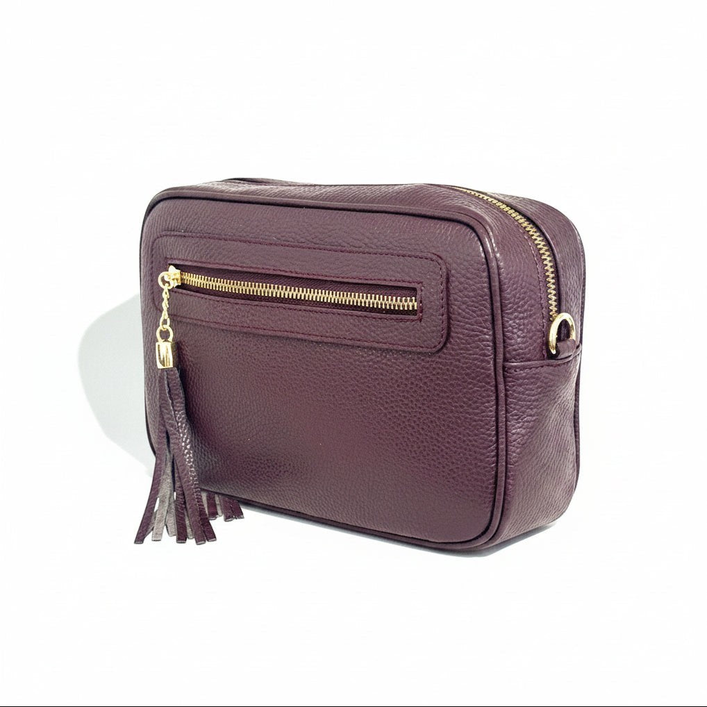 Tracollina Pito’s|Bag in vera pelle color prugna con chiusura a zip e nappina decorativa, design compatto e versatile.