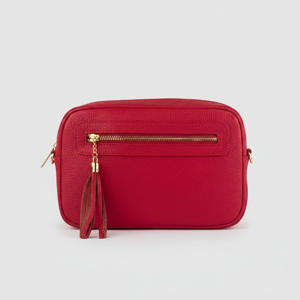 Tracollina Pito’s|Bag in vera pelle rossa con zip frontale e nappina decorativa, design compatto e versatile.