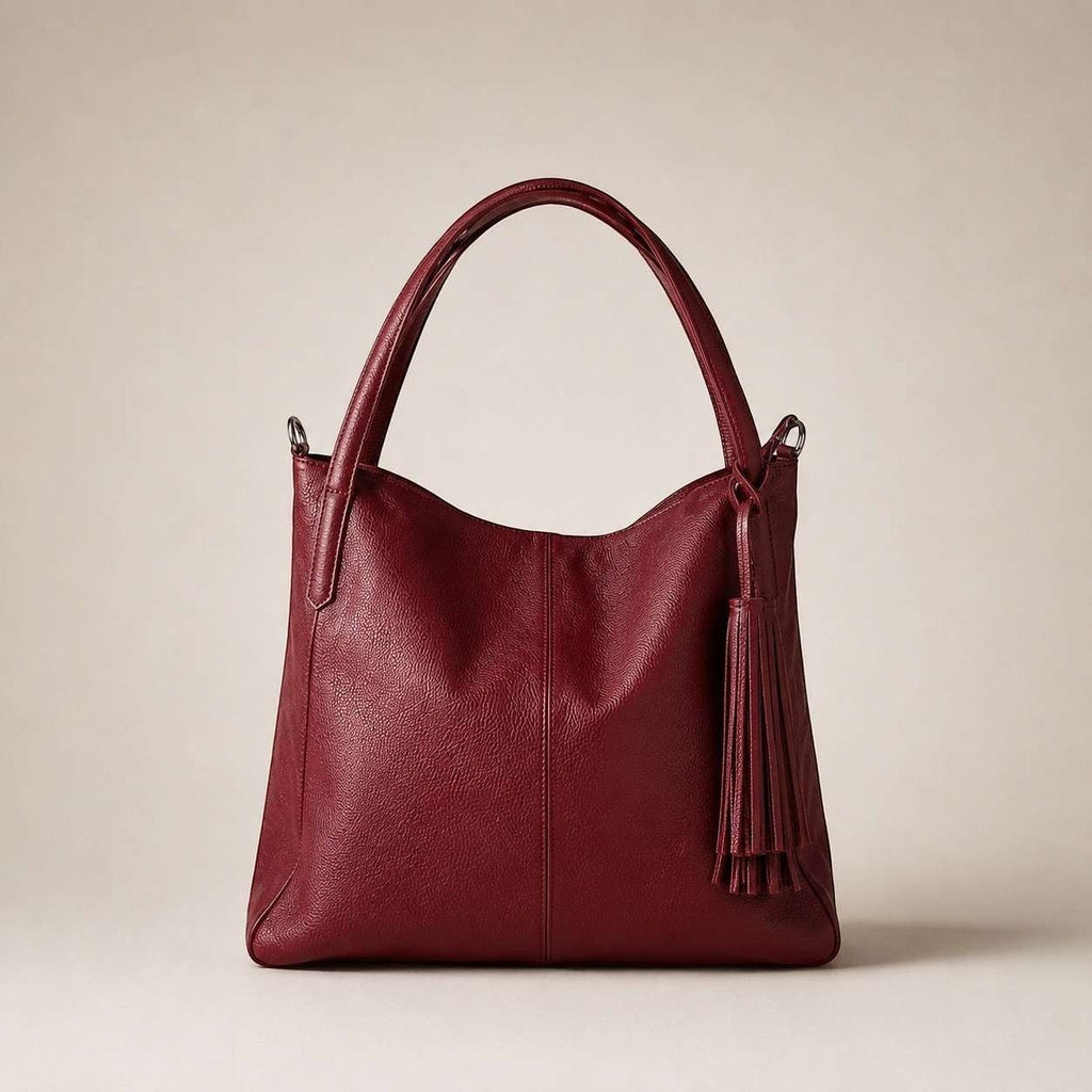 Borsa a spalla Pito’s|Bag in vera pelle martellata color rosso ciliegia con nappa decorativa e design Made in Italy